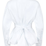 White blouse with a knot detail at the back on a white background